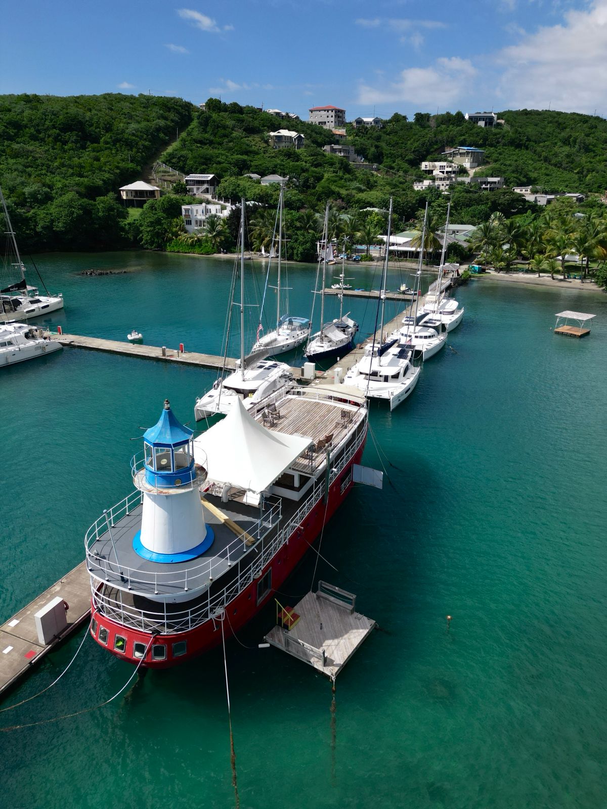 Aerial view of lighthouse boat and marina at best places for investment properties